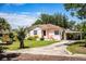 Charming single-story home with a carport, front porch and well maintained lawn at 2710 Fairmount Ave, Lakeland, FL 33803