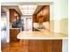 Galley kitchen with stainless appliances and wood cabinets with peninsula seating at 2710 Fairmount Ave, Lakeland, FL 33803