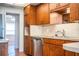 Kitchen featuring stainless steel dishwasher, wood cabinets and a breakfast bar at 2710 Fairmount Ave, Lakeland, FL 33803