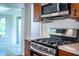 Kitchen with stainless steel appliances including gas range and overhead microwave at 2710 Fairmount Ave, Lakeland, FL 33803
