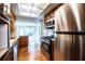 Galley kitchen with stainless appliances and wood cabinets with bar stool seating at 2710 Fairmount Ave, Lakeland, FL 33803