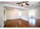 Inviting living room featuring wood-look floors and a well-lit ambiance at 2710 Fairmount Ave, Lakeland, FL 33803