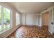 Bright room with tiled floor, doors and large windows view the greenery outside at 2710 Fairmount Ave, Lakeland, FL 33803