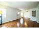 Spacious living room features wood floors, bright natural light, and built-in display shelves at 2710 Fairmount Ave, Lakeland, FL 33803
