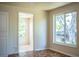 Bright room with tiled floor, and a large window view of the greenery outside at 2710 Fairmount Ave, Lakeland, FL 33803