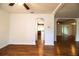 Open living room boasting wood-look floors and open archways, creating an inviting atmosphere at 2710 Fairmount Ave, Lakeland, FL 33803