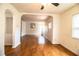Bright living room featuring wood-look floors, archways, and a welcoming entryway at 2710 Fairmount Ave, Lakeland, FL 33803