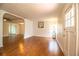 Open living room features wood-look floors, arched doorways, and a bright, airy ambiance at 2710 Fairmount Ave, Lakeland, FL 33803