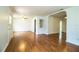 Spacious living room features wood floors, bright natural light, and arched doorways at 2710 Fairmount Ave, Lakeland, FL 33803