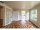 Bright living room featuring unique tile flooring and a built-in storage cabinet at 2710 Fairmount Ave, Lakeland, FL 33803