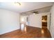 Spacious living room with wood-look floors, open access to other rooms, and a bright ambiance at 2710 Fairmount Ave, Lakeland, FL 33803