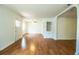 Spacious living room features wood floors, bright natural light, and arched doorways at 2710 Fairmount Ave, Lakeland, FL 33803