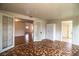 Sunlit living room with unique tile floors, french doors, and built-in storage at 2710 Fairmount Ave, Lakeland, FL 33803