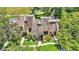 Bird's-eye view features well-maintained townhomes with mature trees and walkways in a lush community at 30 Aspen Dr # 30, Haines City, FL 33844