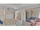 Bedroom with sliding glass door to patio, walk in shower, and closet at 30 Aspen Dr # 30, Haines City, FL 33844