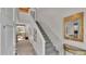 Home entryway with stairs and access to the living room, featuring views of outdoor greenery at 30 Aspen Dr # 30, Haines City, FL 33844