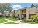 Inviting townhome features a modern exterior with well-manicured landscaping and an attractive entryway at 30 Aspen Dr # 30, Haines City, FL 33844