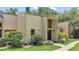 Charming townhome featuring a modern exterior with well-manicured landscaping and inviting entryway at 30 Aspen Dr # 30, Haines City, FL 33844