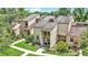 Inviting home exterior with lush landscaping, walkway, and a well-maintained lawn at 30 Aspen Dr # 30, Haines City, FL 33844