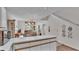 Open-concept living room with staircase, and outdoor views at 30 Aspen Dr # 30, Haines City, FL 33844