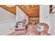 Cozy living room with vaulted wood ceiling, built-in shelving, and comfortable seating area at 30 Aspen Dr # 30, Haines City, FL 33844