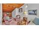 Living room with pink accents, wood ceilings, and plenty of seating at 30 Aspen Dr # 30, Haines City, FL 33844