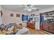 Bedroom with a window, ceiling fan, and closet, showcasing potential at 306 Olmo Ct, Winter Haven, FL 33880