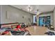 Large bedroom with gray walls, tile flooring, ceiling fans, and open closet at 306 Olmo Ct, Winter Haven, FL 33880