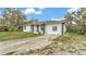Charming one-story home with a large driveway and neutral color palette at 306 Olmo Ct, Winter Haven, FL 33880