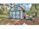 A charming shed provides ample storage space at 306 Olmo Ct, Winter Haven, FL 33880