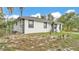 This home has a gated yard and mature landscaping at 306 Olmo Ct, Winter Haven, FL 33880