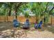 Backyard seating area with fire pit perfect for relaxing and entertaining at 312 Palencia Pl, Lakeland, FL 33803