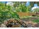 Fully fenced backyard has lush landscaping, fountain, and ample space at 312 Palencia Pl, Lakeland, FL 33803