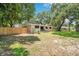 Private backyard with a wooden fence and plenty of space for outdoor activities at 312 Palencia Pl, Lakeland, FL 33803