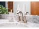 Close-up of marble countertop with faucet and soap dispenser at 312 Palencia Pl, Lakeland, FL 33803