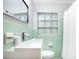 Charming bathroom with vintage mint tile and walk-in shower at 312 Palencia Pl, Lakeland, FL 33803
