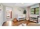 Bedroom with hardwood floors, natural light, and decor at 312 Palencia Pl, Lakeland, FL 33803