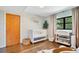 Cozy Bedroom with crib, changing table, decor, and wood floors at 312 Palencia Pl, Lakeland, FL 33803
