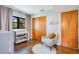 Bright Bedroom with wood floors, plush rug, seat, and decor at 312 Palencia Pl, Lakeland, FL 33803