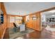 The dining area boasts wood paneling, open floor plan with great natural light at 312 Palencia Pl, Lakeland, FL 33803