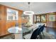 Dining room showcasing glass table and the kitchen view in the background at 312 Palencia Pl, Lakeland, FL 33803