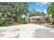 Well-maintained exterior features a spacious driveway and attached carport at 312 Palencia Pl, Lakeland, FL 33803