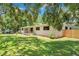 Inviting home exterior with a well-manicured lawn and newly planted landscaping at 312 Palencia Pl, Lakeland, FL 33803