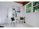 Bright home office with wood panel ceiling and view of lush landscaping at 312 Palencia Pl, Lakeland, FL 33803