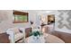 Modern living area with hardwood floors, stylish decor, and comfortable seating, perfect for relaxation and entertaining at 312 Palencia Pl, Lakeland, FL 33803