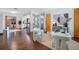 Bright living room featuring hardwood floors and modern decorative touches throughout at 312 Palencia Pl, Lakeland, FL 33803