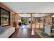Spacious living room with wood paneled walls and an open concept design at 312 Palencia Pl, Lakeland, FL 33803