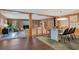 Spacious living room with wood paneling, fireplace, and an open layout perfect for entertaining and modern living at 312 Palencia Pl, Lakeland, FL 33803