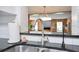 Close-up view of the sink with stainless steel faucet and dark countertops at 312 Palencia Pl, Lakeland, FL 33803
