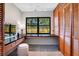 Vanity with dark countertop, stool and natural light at 312 Palencia Pl, Lakeland, FL 33803